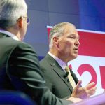Democratic Gov. Jay Inslee (right) and his Republican challenger, Bill Bryant, take part in a debate on Monday in Seattle. (AP Photo/Ted S. Warren)