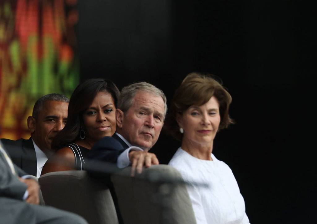 President Barack Obama, first lady Michelle Obama, former President George W. Bush and former first lady Laura Bush listen to Stevie Wonder sing during the opening ceremony of the museum Saturday. (AP Photo/Manuel Balce Ceneta)
