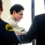 Christopher Garcia Gonzalez is handed over to his defense attorney, Paul Thompson, at the start of his trial Sept. 8. (Dan Bates / Herald file)