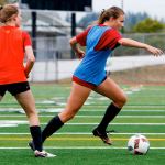 Snohomish midfielder Anna Montemor (right) dribbles past a teammate during practice on Sept. 5. (Andy Bronson / The Herald)