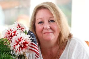 (Dan Bates / The Herald) At Patricia Mackey&rsquo;s Edmonds home, flags, large and small, have been on display every day since 9/11. A photo of her cousin, Dennis Buckley, who died in the North Tower, sits on the kitchen table. He was 38 and had a wife and three daughters. Mackey, a registered 9/11 family member, doesn&rsquo;t want people to ever forget. She has been to the site and read the names of victims.