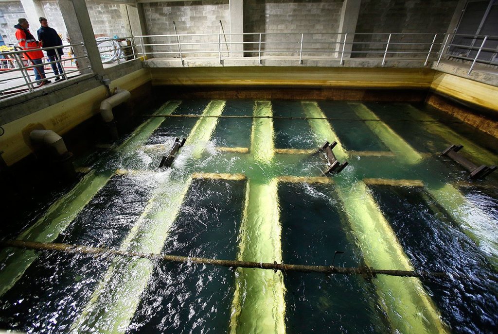 One of eight complex filtration chambers in the water department at Lake Chaplain fills and flushes large volumes of water. (Dan Bates / The Herald)