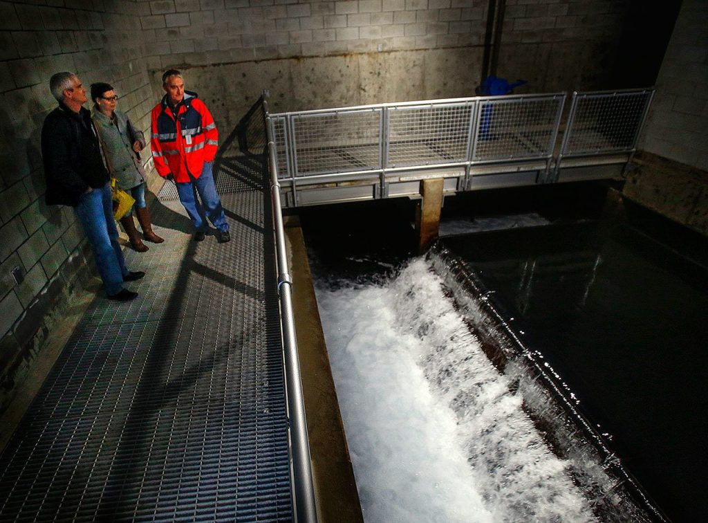 Walking though the water plant, filtered or about to be filtered water from Spada Lake, then Lake Chaplain, appears to be moving throughout the filtration plant, over spillways and beneath raised walkways. &ldquo;We take clean water and make it cleaner,&rdquo; said John McClellan, operations superintendent, at left with Kathleen Baxter, PIO, and Mark Weeks, plant manager. (Dan Bates / The Herald)