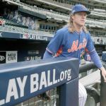 New York Mets pitcher Noah Syndergaard steps onto the field for a team workout before Wednesday night&rsquo;s NL wild-card showdown with Madison Bumgarner and the San Francisco Giants in New York. (AP Photo/Julie Jacobson)