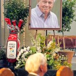 A set of golf clubs and a photo of Arnold Palmer sit in the Basilica at Saint Vincent College in Latrobe, Pa., during a memorial service for the iconic golfer in his hometown on Tuesday. (AP Photo/Gene J. Puskar)