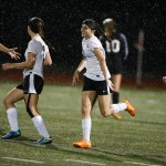 Marysville-Getchell&rsquo;s Hayli Huhta (center) smiles after scoring to go up 2-0 on Snohomish in the first half of a game at Marysville-Getchell High School on Tuesday, Oct. 4. (Ian Terry / The Herald)