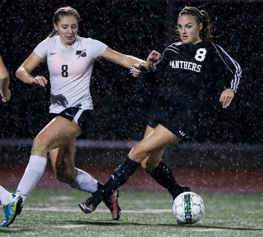 Snohomish&rsquo;s Anna Montemor (right) brings the ball up field as Marysville-Getchell&rsquo;s Gabrielle Grandbois defends during a game at Marysville-Getchell High School on Tuesday, Oct. 4. (Ian Terry / The Herald)