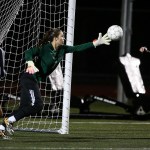 Marysville-Getchell goalkeeper Carley Wika (center) reaches out to grab a loose ball as Snohomish&rsquo;s Taylor Khorrami (16) and Anna Montemor (8) look on during a game at Marysville-Getchell High School on Tuesday, Oct. 4. (Ian Terry / The Herald)