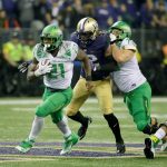 Oregon&rsquo;s Royce Freeman (21) carries the ball against Washington of the second half of the Ducks&rsquo; 26-20 win over the Huskies in Seattle on Oct. 17, 2015. UW will be looking for its first win against UO in 12 tries this Saturday in Eugene. (AP Photo/Ted S. Warren)