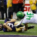 Washington quarterback Jake Browning (3) goes down on a keeper play as Oregon linebacker Danny Mattingly (46) pursues during a game Oct. 17, 2015, in Seattle. (AP Photo/Ted S. Warren)