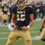 Navy quarterback Will Worth (15) celebrates his touchdown during the first half of a game against Houston on Saturday in Annapolis, Md. (AP Photo/Nick Wass)