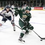 Everett&rsquo;s Jake Christiansen (right) controls the puck with Tri City&rsquo;s Parker AuCoin trailing in the first period of a game Oct. 5 at Xfinity Arena in Everett. (Kevin Clark / The Herald)