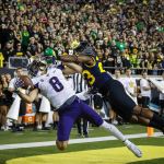 Washington wide receiver Dante Pettis (8) makes a one-handed catch for a touchdown with pressure from Oregon defensive back Malik Lovette (23) during a game Saturday in Eugene, Ore. (AP Photo/Thomas Boyd)