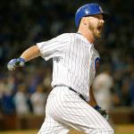 Chicago pitcher Travis Wood reacts after hitting a home run in the fourth inning of the Cubs&rsquo; 5-2 win over the San Francisco Giants in Game 2 of the NLDS on Saturday in Chicago. (AP Photo/Nam Y. Huh)