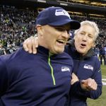 Seahawks head coach Pete Carroll (right) celebrates with defensive coordinator Dan Quinn, now the Falcons head coach, after defeating the Rams on Dec. 28, 2014, in Seattle. (AP Photo/Scott Eklund)