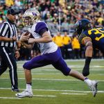 Washington quarterback Jake Browning (3) scores on the last drive of the first half against Oregon on Saturday in Eugene, Ore. (AP Photo/Thomas Boyd)