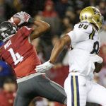 Washington State safety Charleston White (4) intercepts a pass intended for UCLA tight end Austin Roberts (88) near the end of a game Saturday in Pullman. Washington State won 27-21. (AP Photo/Young Kwak)