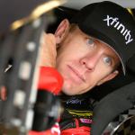 NASCAR Sprint Cup driver Carl Edwards looks out of his race car while waiting for practice to start Friday at Kansas Speedway in Kansas City, Kan. (AP Photo/Ed Zurga)