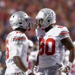 Ohio State&rsquo;s J.T. Barrett (left) and wide receiver Noah Brown celebrate after Brown caught a touchdown pass against Wisconsin in overtime of a game Saturday in Madison, Wis. Ohio State won 30-23. (AP Photo/Andy Manis)