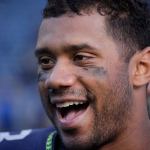 Seahawks quarterback Russell Wilson smiles after a game against the Dolphins on Sept. 11 in Seattle. (AP Photo/Elaine Thompson)