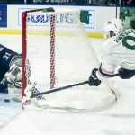 Silvertips left wing Dominic Zwerger (right) tries to wrap around the net for a shot attempt against Seattle goalie Rylan Toth during a game Saturday at Xfinity Arena in Everett. (Ian Terry / The Herald)