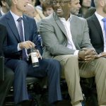 Golden State assistant coach Mike Brown (right) laughs with head coach Steve Kerr during a preseason game in Oakland, Calif. on Oct. 4. Brown survived a kitchen fire in his home in late May. (AP Photo/Ben Margot, File)