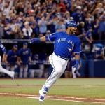 The Blue Jays&rsquo; Edwin Encarnacion celebrates after his two-RBI double against the Indians during the seventh inning of Game 4 of the American League Championship Series on Tuesday in Toronto. (Mark Blinch/The Canadian Press via AP)