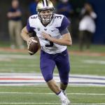 Washington quarterback Jake Browning (3) looks to pass during the first half of a game against Arizona on Sept. 24 in Tucson, Ariz. (AP Photo/Rick Scuteri)