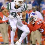 New York Jets&rsquo; (87) is hit by Buffalo&rsquo;s Kevon Seymour (29) during a Sept. 15 game in Orchard Park, N.Y. Decker will be out longer than expected after having hip surgery before a scheduled shoulder operation. (AP Photo/Adrian Kraus)