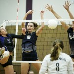 Lake Stevens&rsquo; Gabby Gunterman (5) leaps up as Glacier Peak&rsquo;s Lauren Sanders (16) and Sydney Petersen (34) make a block attempt during a game at Lake Stevens High School on Tuesday, Oct. 18. (Ian Terry / The Herald)