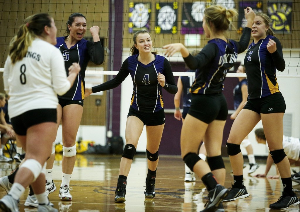 Lake Stevens players (from left) Emily Lubick, Gabby Gunterman, Grace Schroedl, Melissa Stevens and Lilly Eason celebrate a point during a game against Glacier Peak at Lake Stevens High School on Tuesday, Oct. 18. (Ian Terry / The Herald)