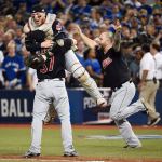 The Indians&rsquo; Cody Allen (37), Roberto Perez (55) and Mike Napoli (right) celebrate the team&rsquo;s 3-0 victory over the Blue Jays after Game 5 of the American League Championship Series on Wednesday in Toronto. (Nathan Denette/The Canadian Press via AP)