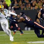 Packers quarterback Aaron Rodgers (12) tries to run away from Bears outside linebacker Leonard Floyd (94) during the first half of a game Oct. 20 in Green Bay, Wis. (AP Photo/Matt Ludtke)