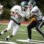 Edmonds-Woodway&rsquo;s Jalen Nash (left) turns after catching a pass during a team practice on Tuesday. (Ian Terry / The Herald)