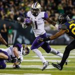 Washington wide receiver John Ross (1) gets past Oregon defensive back Khalil Oliver (26) during a game Oct. 8 in Eugene, Ore. Washington won 70-21. (AP Photo/Thomas Boyd)