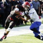Archbishop Murphy&rsquo;s Collin Montez (left) runs through Olympic&rsquo;s Darelle White during a game at Archbishop Murphy High School on Saturday. (Ian Terry / The Herald)