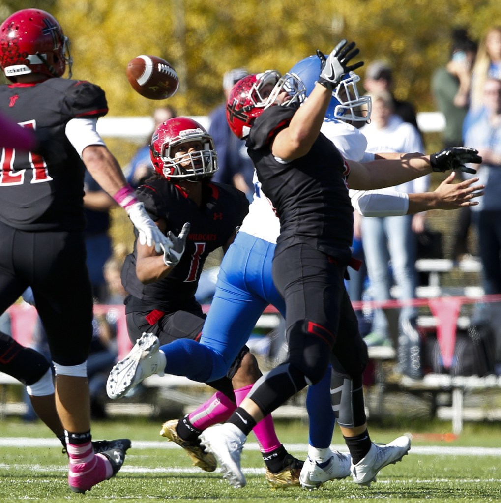 A tipped ball leads to a Archbishop Murphy interception during a game against Olympic on Saturday. (Ian Terry / The Herald)