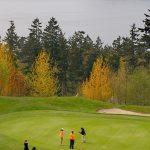 A foursome of women play the 11th green at the Harbour Pointe golf course in Mukilteo in 2008. (File photo)