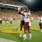 Washington State&rsquo;s Jamal Morrow (25) celebrates his touchdown catch with teammate Isaiah Johnson-Mack during the Cougars&rsquo; victory over Arizona State on Saturday in Tempe, Ariz. (AP Photo/Matt York)