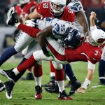 Cardinals quarterback Carson Palmer (3) is hit after the throw by Seahawks defensive end Frank Clark (55) during the first half of a game Oct. 23 in Glendale, Ariz. (AP Photo/Ross D. Franklin)