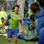 Sounders forward Nelson Valdez (16) celebrates after he scored a goal against Sporting Kansas City in the second half of a playoff match Thursday in Seattle. The Sounders won 1-0. (AP Photo/Ted S. Warren)