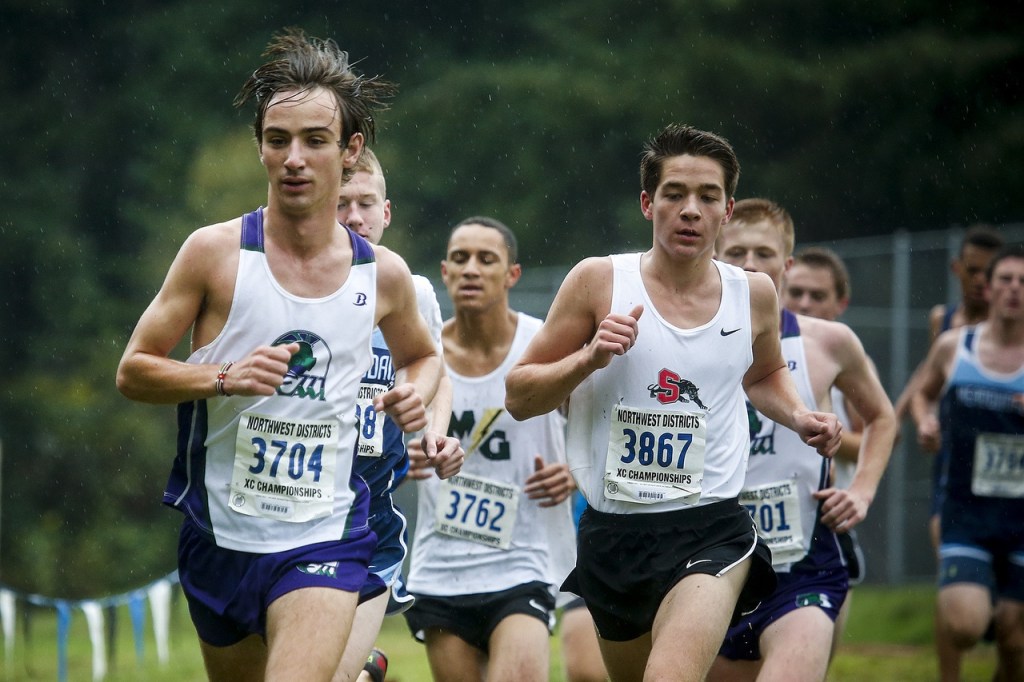 Edmonds-Woodway&rsquo;s Matthew Park (left) leads the pack early on before winning the boys 3A District 1 cross country meet at South Whidbey High School on Saturday. (Ian Terry / The Herald)