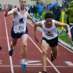Edmonds-Woodway&rsquo;s Sam McCloughan (left) narrowly edges out Snohomish&rsquo;s Aaron Leavens for third place at the boys 3A District 1 cross country meet at South Whidbey High School on Saturday. (Ian Terry / The Herald)