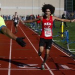 Bellingham&rsquo;s Cade Brown celebrates his victory in the boys 2A District 1 championship at South Whidbey High School on Saturday. (Ian Terry / The Herald)