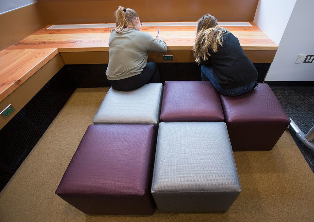 After testing out sitting cubes, two junior high students grade various chairs at North Creek High School on Wednesday, Oct. 19, 2016 in Bothell, Wa. Students from local junior and senior high schools tested and graded three different sets of chairs and desks that the Northshore School District may purchase for the new high school. (Andy Bronson / The Herald)