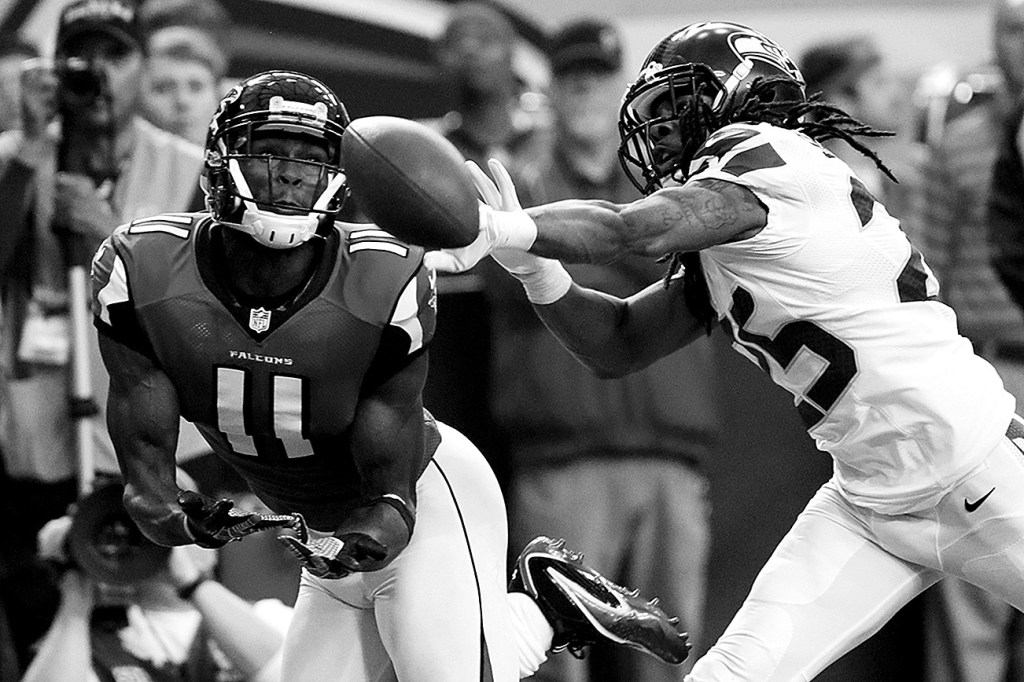 Dave Martin / Associated Press                                Seattle cornerback Richard Sherman (right) defends against Atlanta wide receiver Julio Jones during an NFC playoff game in January of 2013.