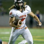 Monroe running back JJ Jerome eludes a tackler during a game against Glacier Peak on Sept. 30 in Monroe. (Kevin Clark / The Herald)