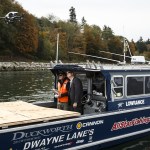 U.S. Rep. Rick Larsen (center) watches as a drone piloted by Burlington Northern and Santa Fe Railway&rsquo;s Nolan Rubalcaba takes off near a seawall south of downtown Everett on Wednesday morning. BNSF has embraced drone technology and gone through steps to become approved by the FAA for use as a tool to help examine infrastructure and railways. (Ian Terry / The Herald)