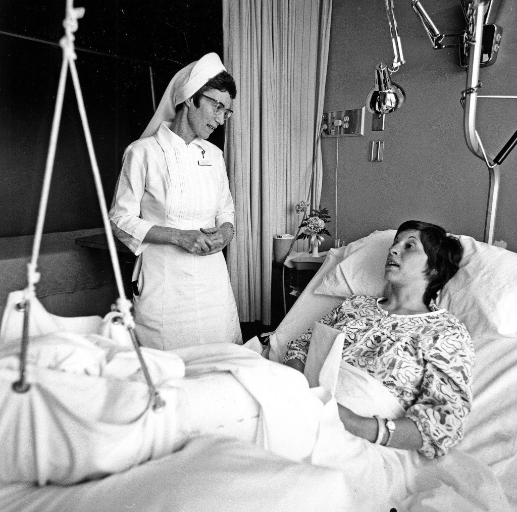 Sister Georgette Bayless with patient at Providence Hospital in 1975. Sister Bayless, founder of Providence Hospice and Home Care of Snohomish County, died Sept. 25 at age 94.