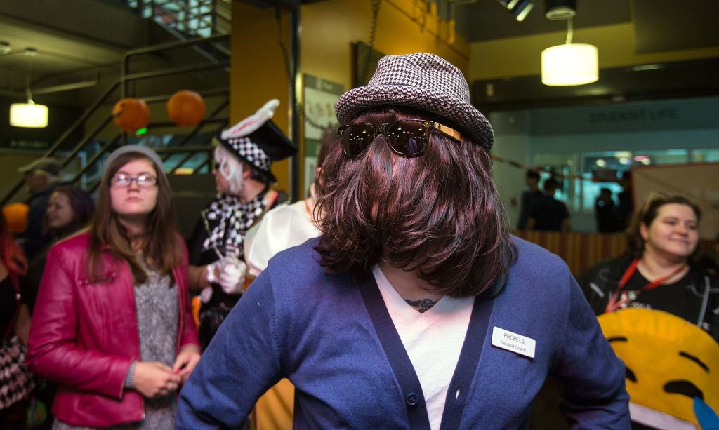 Dressed as Cousin It and using his own hair, Mike Marshall lines up to compete in the Hallo-Scream Contest at Everett Community College on Monday. (Andy Bronson / The Herald)